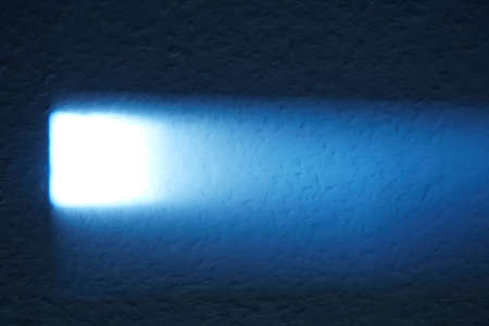 A wall that is brightly illuminated by the sun.の写真素材