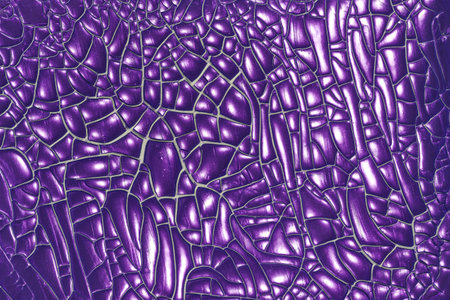 Color surface created with facetted varnish as an abstract background.