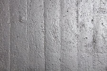 Shiny concrete wall sprayed with paint as background.の写真素材
