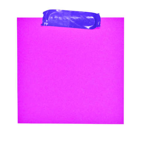 Small sticky note in front of white background.の写真素材