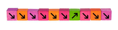 Colorful wooden cubes lie side by side in front of a white background.