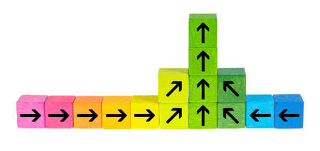 Colorful wooden cubes lie side by side in front of a white background.の写真素材