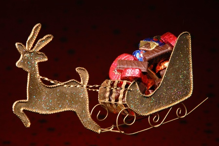 sweets on golden sleigh of Santa Clausの写真素材