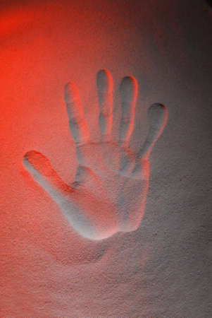 Trace your hand on the colored sandの写真素材