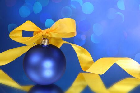 Christmas balls and light on a blue backgroundの写真素材