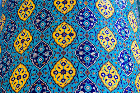 mosaic covering mosque walls about outside, blue saturated color, straight lines and flower patternsの写真素材