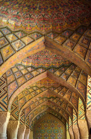 SHIRAZ, IRAN, APRIL 14, 2016 - columns and crayfish with a set of patterns and arnametn, multi-colored paints and stained-glass windows, carved patterns the colon and ceilings, lights soft rasseeny lightのeditorial素材