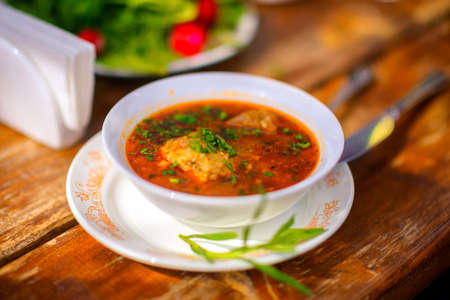 plate of tasty tasty soup with vegetables and greens, nourishing healthy foodの写真素材