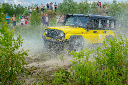 Belarus, Brest, 2016 - off-road competitions, the SUV overcomes an obstacle, a set of splashesのeditorial素材