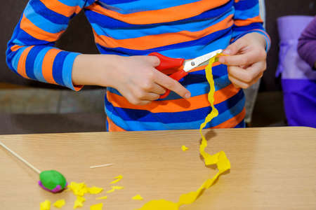 at a lesson of the fine arts, children do hand-made articles of paperの写真素材