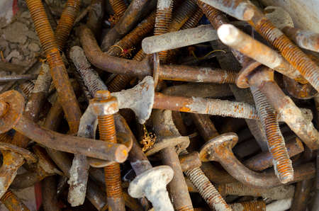 Background, heap of rusty boltsの写真素材