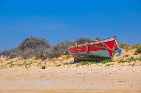 fishing boat standing on the coast of the Atlantic ocean in Moroccoの写真素材