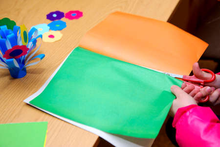 children at a lesson of the fine arts do hand-made articles of paperの写真素材