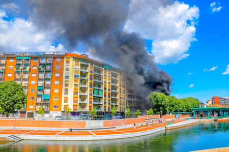 fire in a house in one of the quarter of Paris, a set of black smoke, extraordinary incidentの写真素材