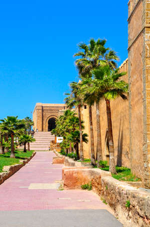 Fortifications around a historical part of the city of Rabat, a structure are plastered by clay of saturated orange colorの写真素材