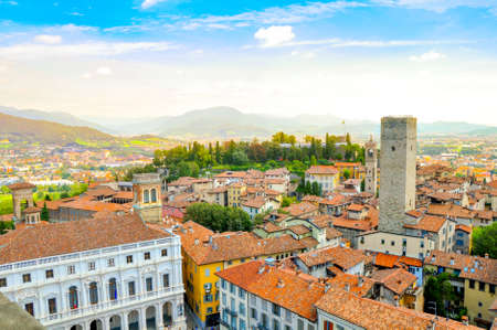 View from a roof on the small French town located in the foothills of the Alps in bright sunny day. A set of the lodges constructed in traditional styleの写真素材