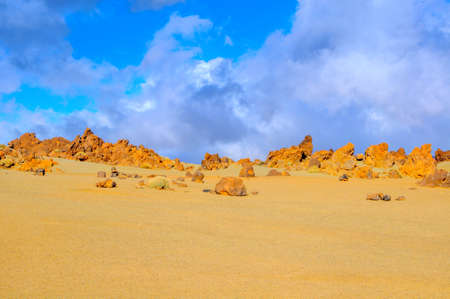 desert area in mountains of the island of Tenerife in bright sunny day, stones of volcanic origin