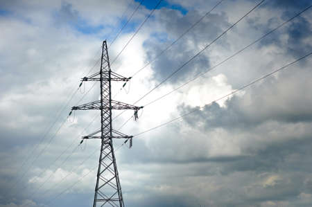 High-voltage line of electricity, in the background the sky is frowning