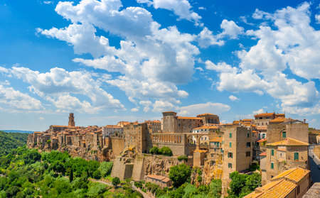 Panorama of the medieval town of Pitigliano located on the edge of the cliff, with beautiful clouds in the sky, Tuscany. Italy. Europeの写真素材