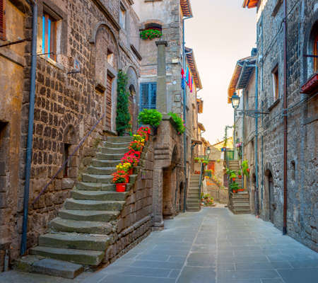 Beautiful flower street in a medieval village in Tuscany. Pitigliano. Italyの写真素材