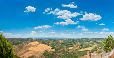 panorama of the Tuscan valley at sunset, many guest villas on the hills, Italy. Europeの写真素材