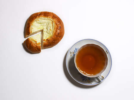 Cheesecake and cup of jasmine teaの写真素材