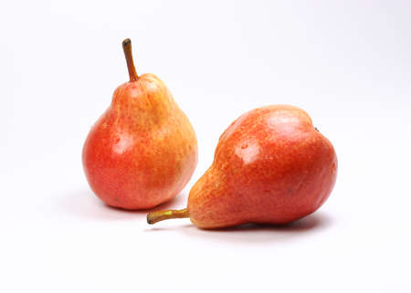 Closeup of two red pears on white backgroundの写真素材