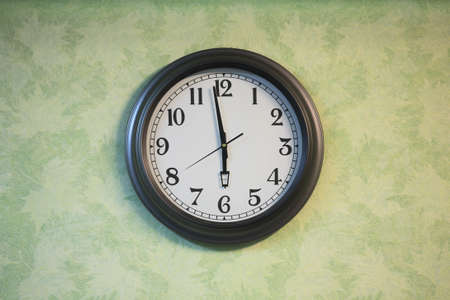 Closeup of clock on the old wallの写真素材