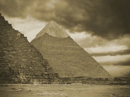 Pyramids of Gizeh near Cairo in Egypt on a cloudy dayの写真素材