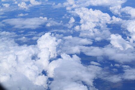 Flight by the plane. Cumulus clouds