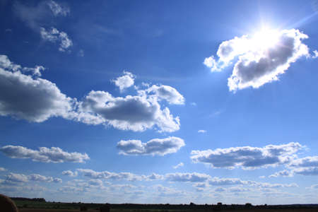 The sun appears because of a cloudの写真素材