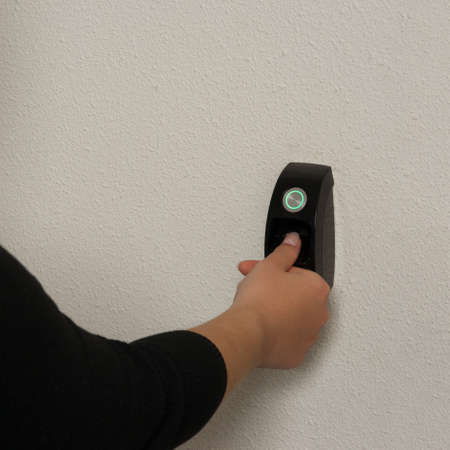 Biometric scan of a finger to get access to a room