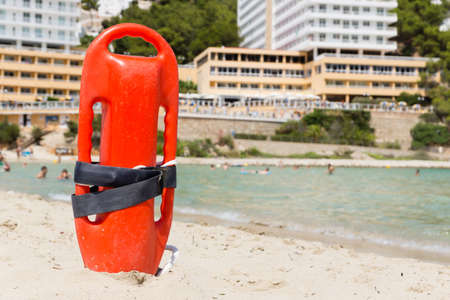 a red buoy on a sunny beachの写真素材