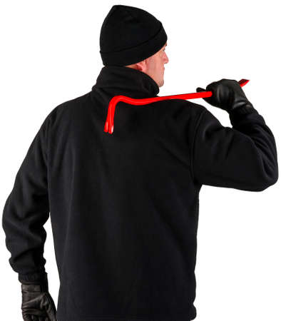 caucasian burglar with a crowbar in his handの写真素材