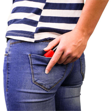Young woman is stealing goods in a shop
