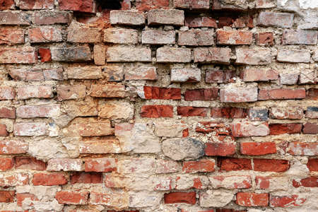 the outer wall of red bricks crumble,, an ancient structure