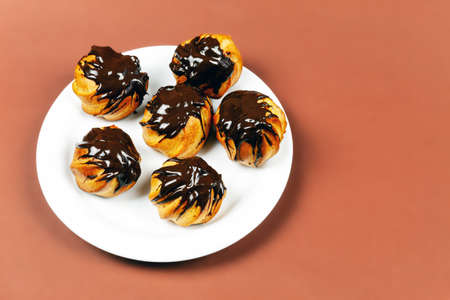 The product is made from flour, eggs, sugar. Top view covered with chocolate