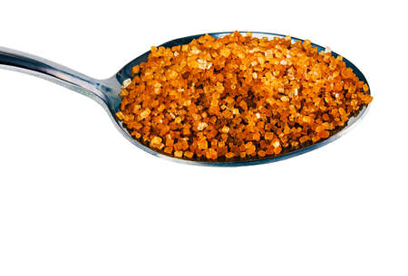 spoon of unrefined brown sugar isolated with space for textの写真素材
