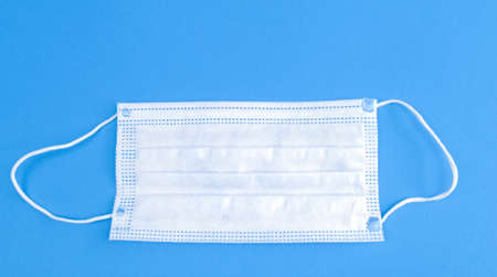 face protection against viruses on a blue backgroundの写真素材