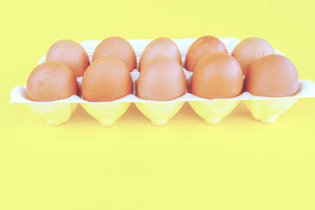 eggs on a yellow background with space for text