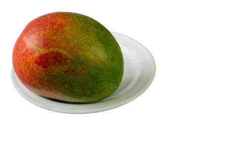 close-up on a white background mango fruit isolated with a place for a copyの写真素材