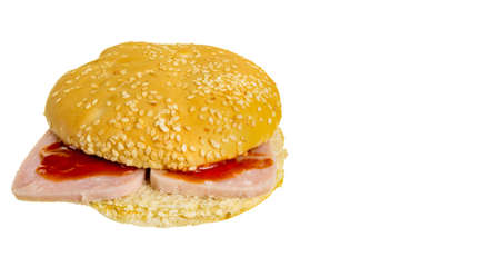 Round burger bun with meat and tomato sauce on a white background, isolatedの写真素材