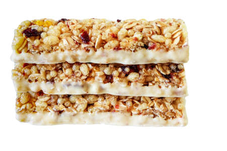 Cereal bar with wild berries and yoghurt glaze on a white background, isolatedの写真素材