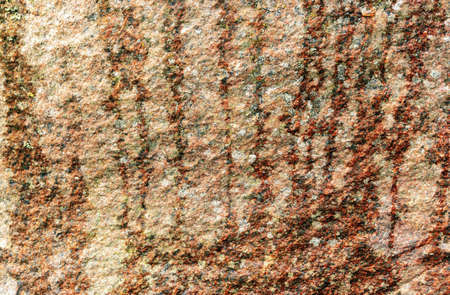 Old outdoor stone surface texture background with moss