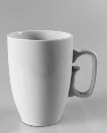 Large gray cup with handle on a gray background, vertical viewの写真素材