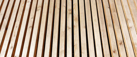 Texture background of a coniferous wooden wooden bench outsideの写真素材