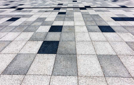 A background of paved mosaics in the city viewed from above in the distanceの写真素材