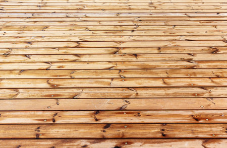 Outdoor pine wood plank floor fastening with wood screws texture background