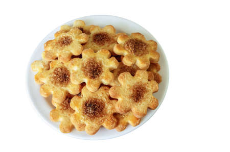 a bunch of cookies with cinnamon and sugar in a plate, isolated on a white background
