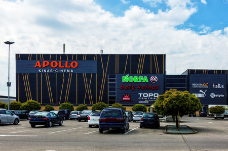Apollo cinema building against a sky background with ads from various stores. Panevezys, Lithuania, June 04, 2022.のeditorial素材